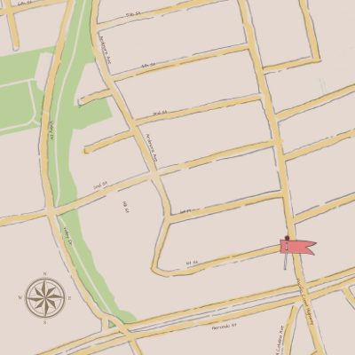 A stylized map showing the location of Harmony Yoga studio, marked with a red flag, near the intersection of 1st Street and Pacific Coast Highway.