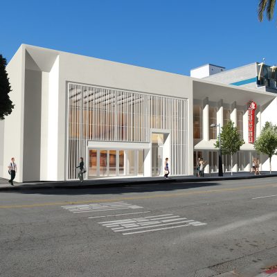 Architectural rendering of the newly renovated Laemmle Monica Film Center, a modern white building with a slatted facade and a red 'Laemmle' sign, seen from across the street in Santa Monica.