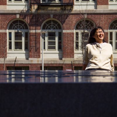 Under the Laurentide, a new work by sculptor Maya Lin, celebrates the form, function, and environmental significance of Narragansett Bay. The sculpture, installed Friday at the east entrance to the Building for Environmental Research and Teaching, was dedicated Wednesday, April 22. Made of Chelmsford granite, the hefty sculpture measures 11 feet by seven feet and stands 27 inches high. Its circular tabletop is etched with a topographical map of the bottom of Narragansett Bay, interspersed with small openings that gently pump water out across the surface and over glass dams placed along the edges where water naturally flows out of the Bay.