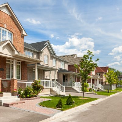 Suburban residential street with red brick houses