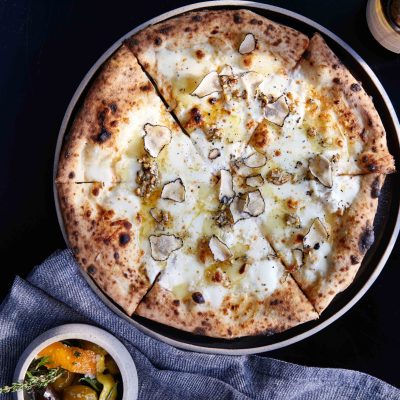 The Tartufo pizza is topped with fontina, fior di latte mozzarella, pine nuts, and, of course, norcia black truffle.